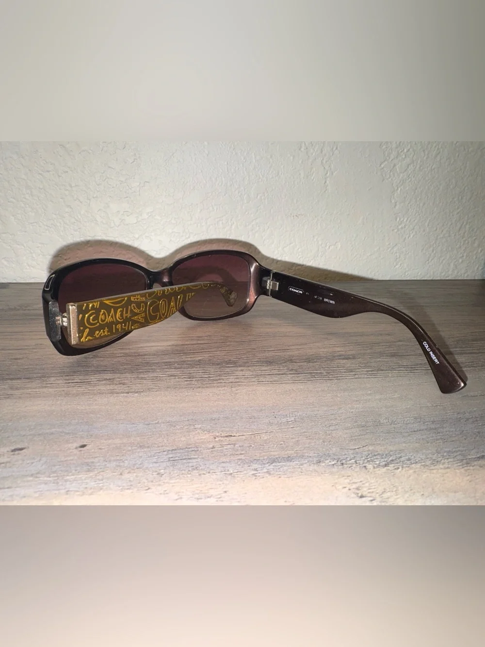 Coach Women’s Brown Sunglasses with Yellow Logo Accent